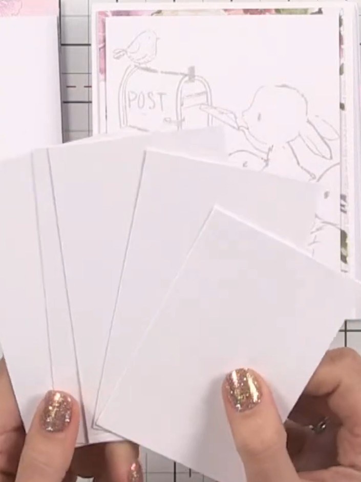 Step 10: Use leftover white card pieces to create tags. Mark dots with a pencil to form tag shapes, then cut between th