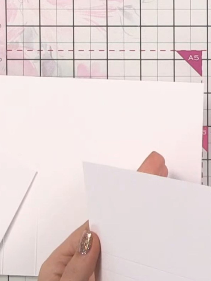 Step 3: Cut two pocket pieces from white card, each measuring 6¾ by 3½ inches. Score each pocket piece at ½ inch and 1