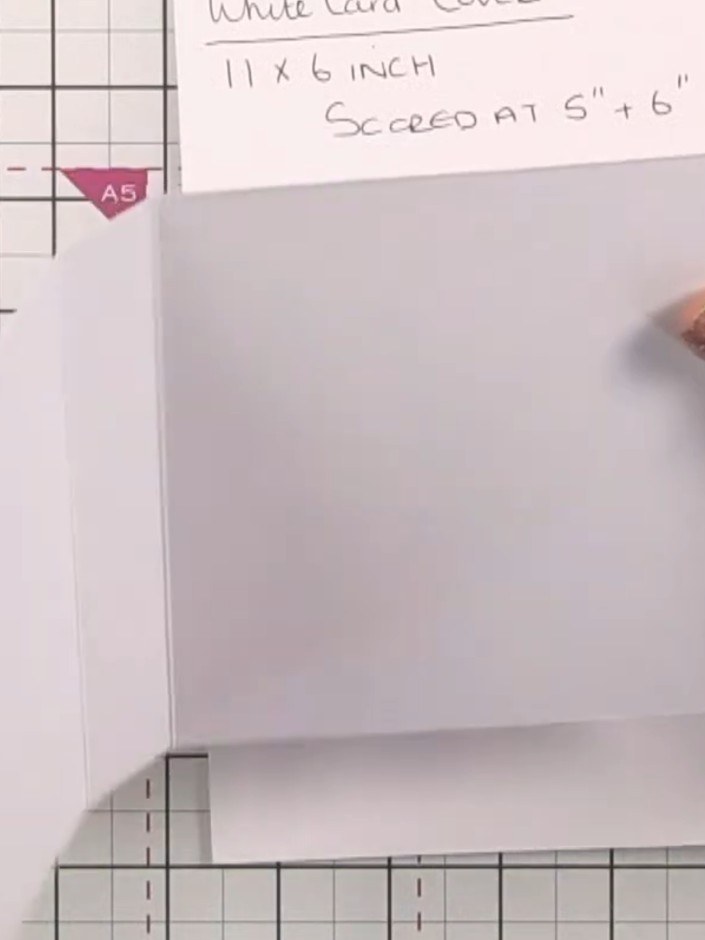 Step 6: Fold the white card cover along the score lines at 5" and 6" to create the pocket shape with gussets.