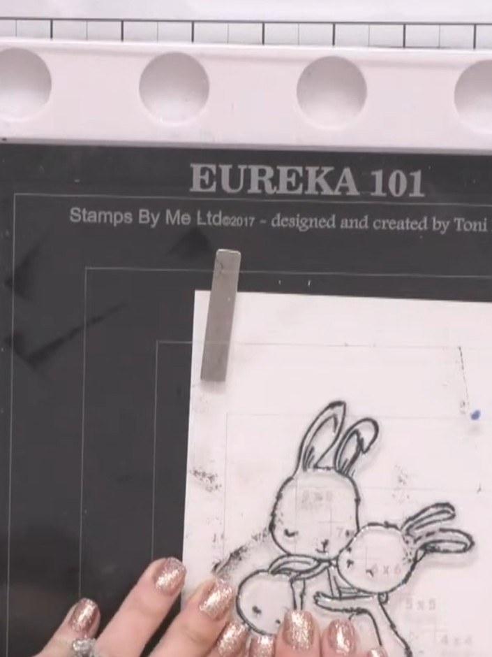 Step 1: Stamp the bunny design onto white watercolour card using a black ink pad. Position the stamp carefully and pre