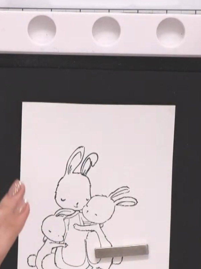 Step 2: Create a mask by stamping the same bunny design onto vellum. Carefully cut out the stamped image to use as a m