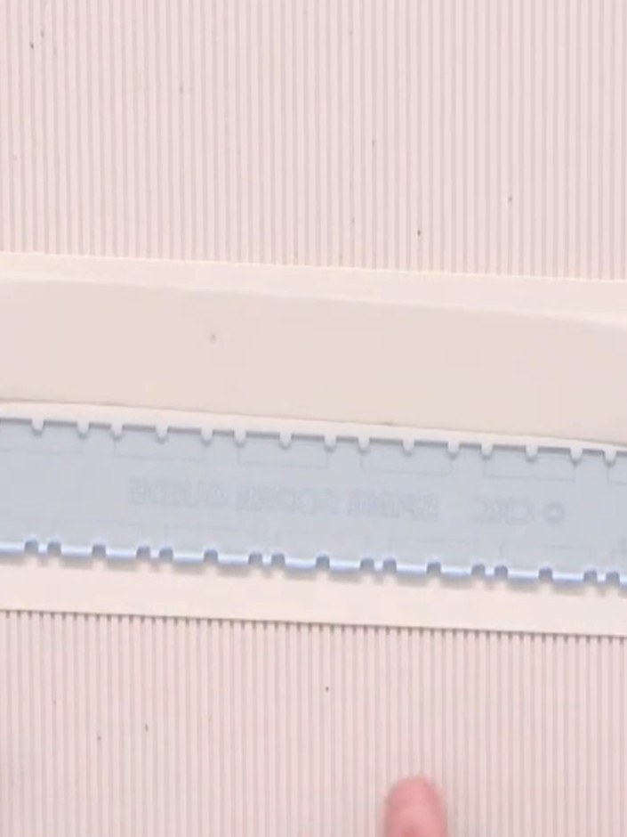 Step 1: Select your desired gusset width on the album spine scoring guide. The tool offers two options: quarter inch o