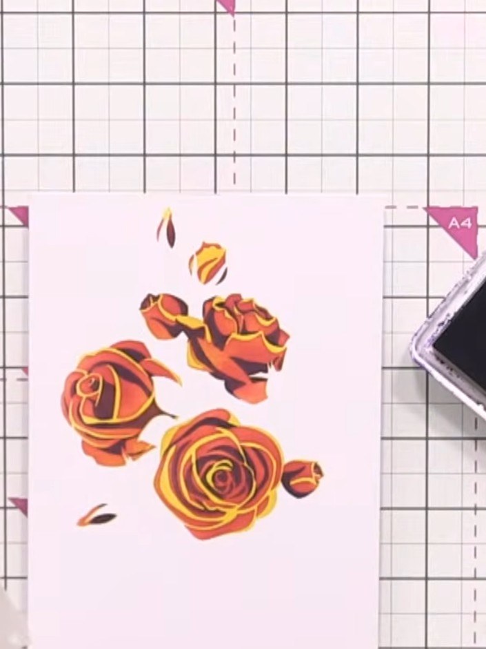 Step 6: Position the leaf stencil over your stamped roses and ink through with green ink, pressing firmly to build up 