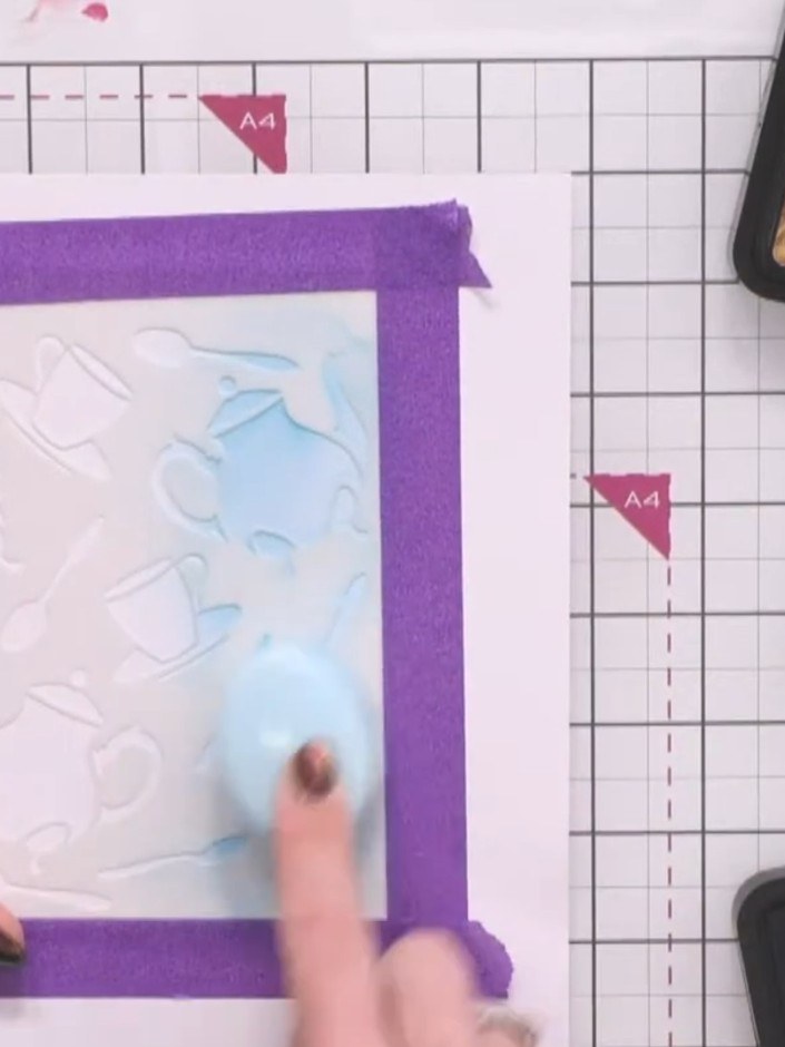 Step 1: Apply Distress Ink in Peacock Feathers, Faded Jeans and Vintage Photo across your white embossed cardstock. St