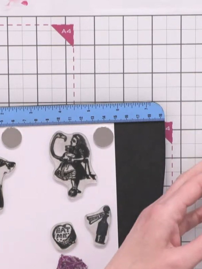 Step 1: Stamp out multiple images from the Alice stamp sets onto white cardstock. Include the Flamingo, Mad Hatter, Qu