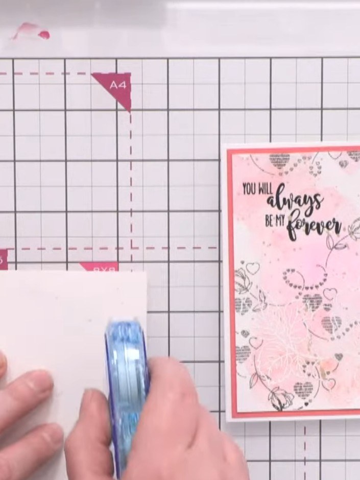 Step 2: Position the cascading heart stencil on your dried watercolour base. Apply soft pink ink using a Funky Fossil 