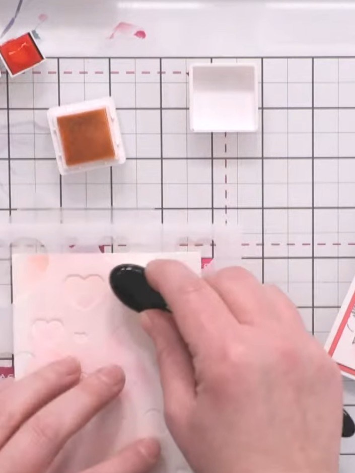 Step 3: Reposition the stencil slightly and apply a darker shade of pink through the same stencil using a blending bru