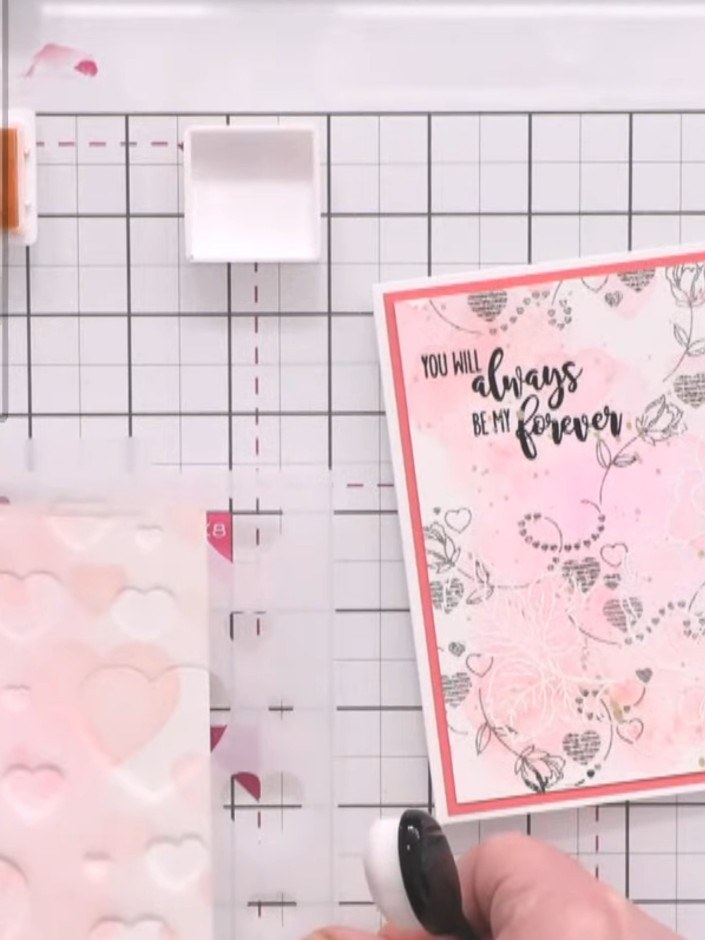 Step 3: Using a blending brush, apply a darker poppy red shade through the scattered hearts stencil in selected areas 