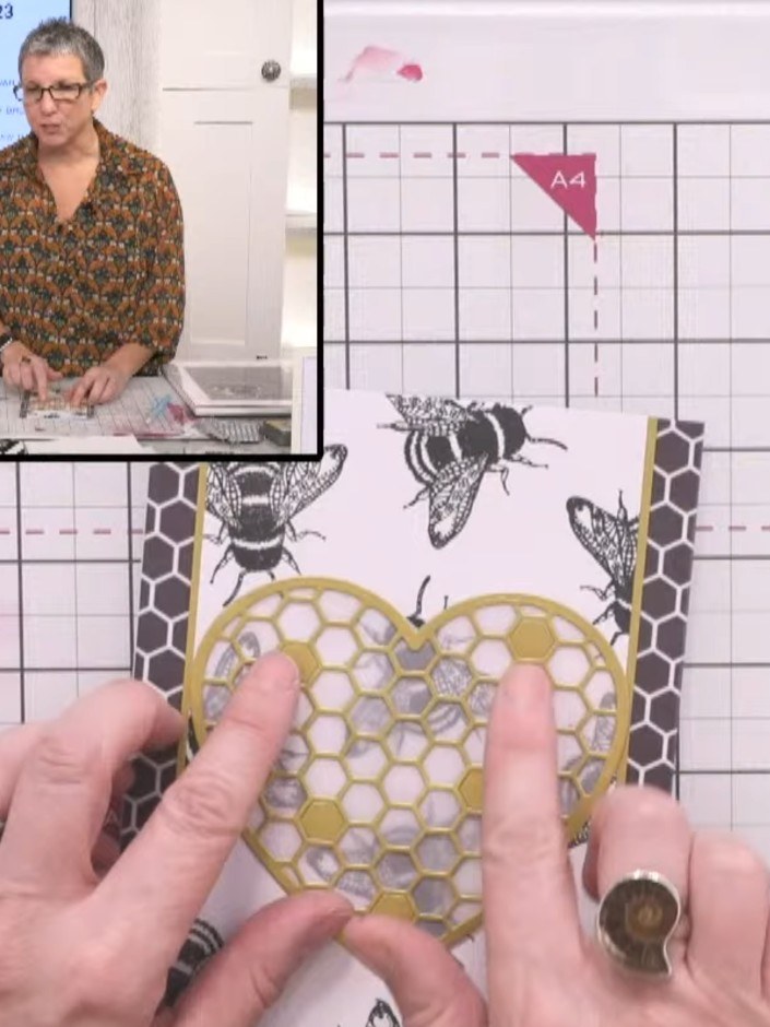 Step 5: Position the gold honeycomb heart die cut over the vellum background. Carefully trim around the heart shape to