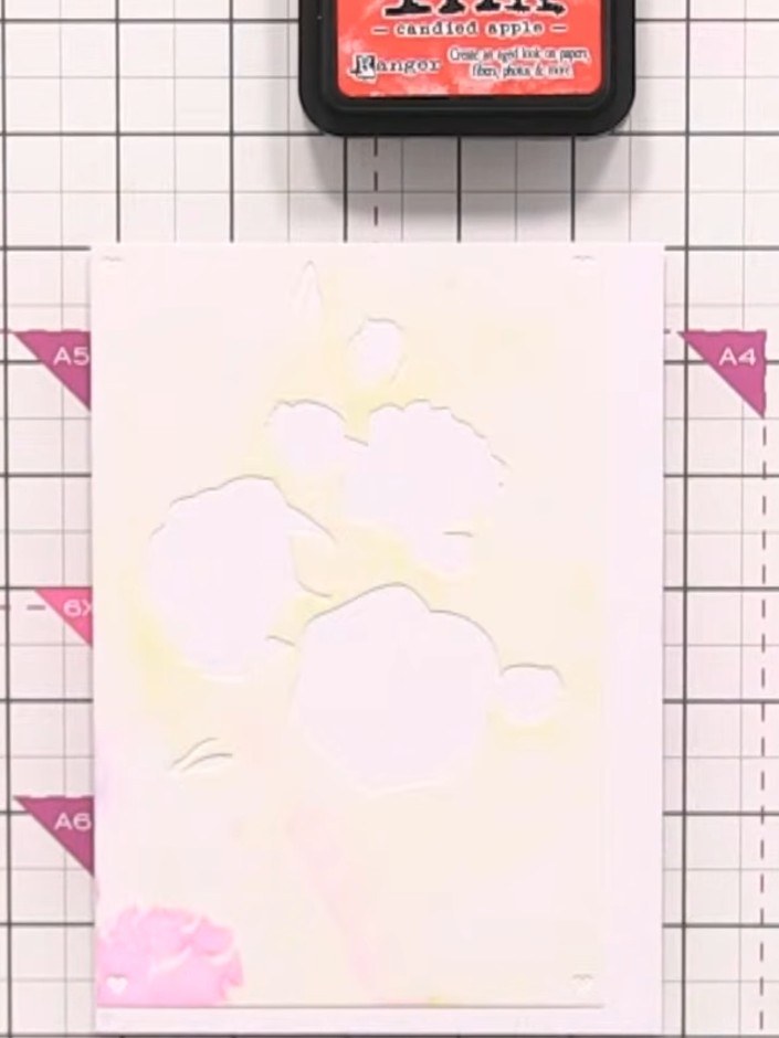 Step 2: Position stencil number one on your white card stock, aligning it with the edge of the card. The stencil featu