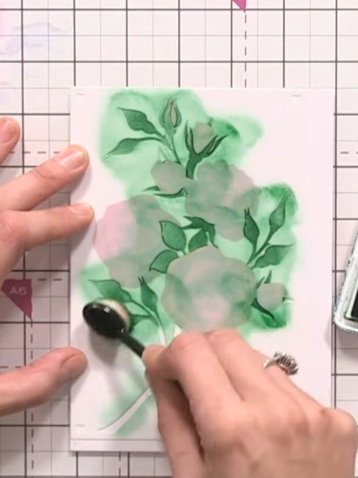 Step 7: Apply stencil number five over your design and ink through with green ink, pressing firmly to complete the lea