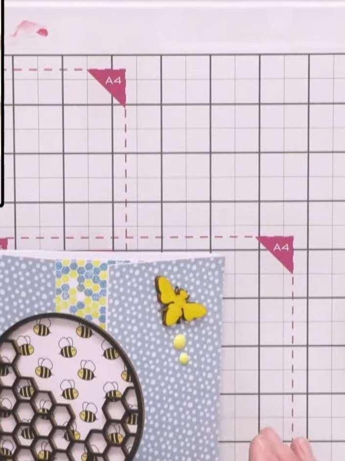 Step 11: Add yellow enamel dots around the honeycomb focal point and along the flight path of the butterfly to complete