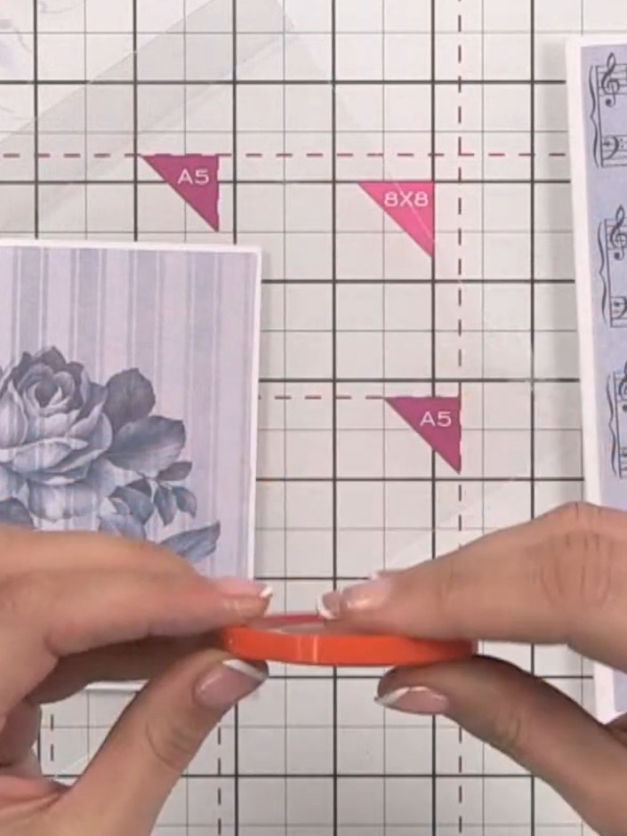 Step 6: Adhere the card blank to the back of the acetate using red liner tape, ensuring it is centred with a small hal