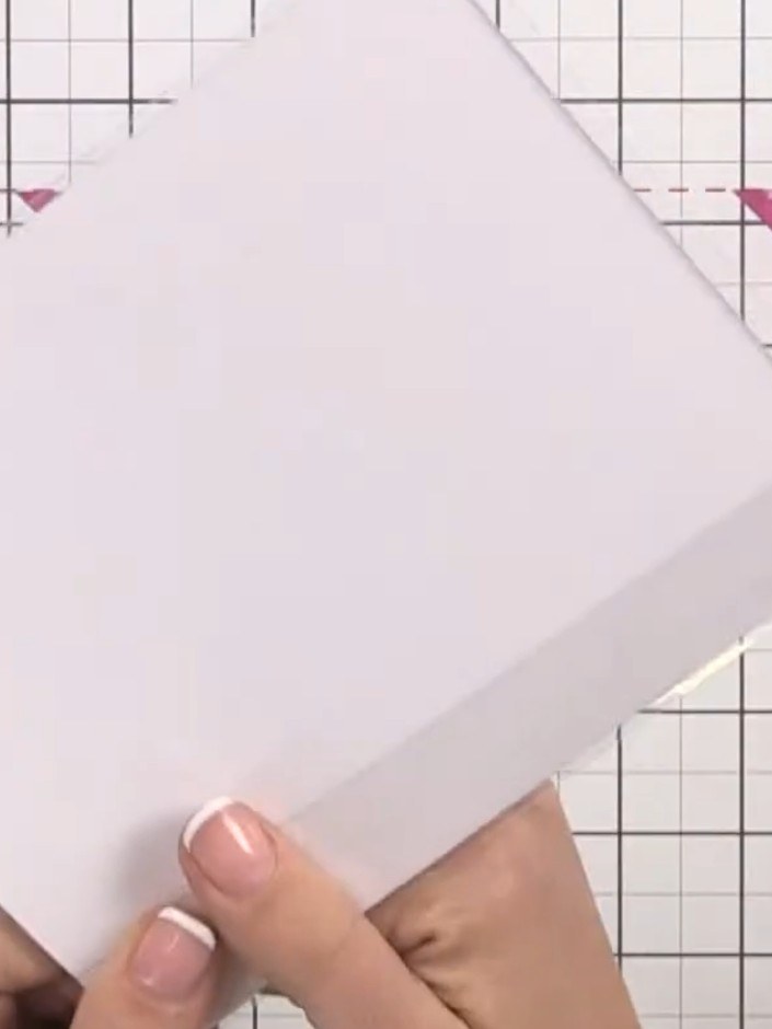 Step 9: Cut a piece of patterned paper to cover the inside back panel of the card, hiding the acetate and red liner ta