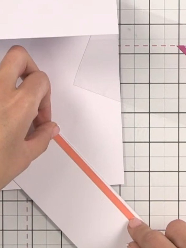 Step 4: Apply adhesive tape along the edge of the acetate sheet. Position and adhere the acetate to the inside back of