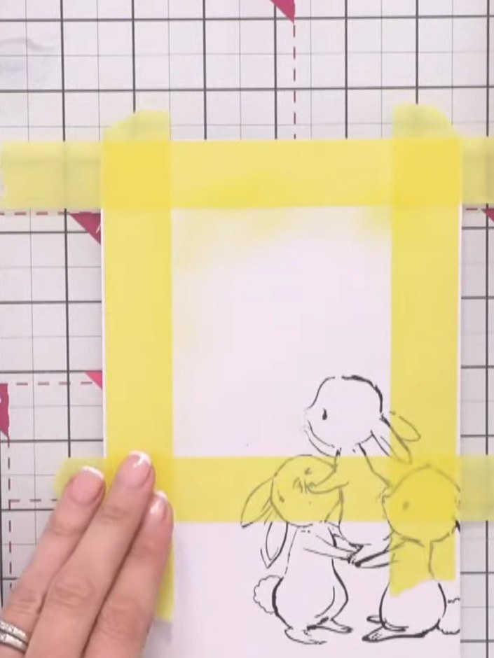 Step 10: Apply yellow pigment ink lightly across the masked area using a brush or sponge applicator. Work gently to cre