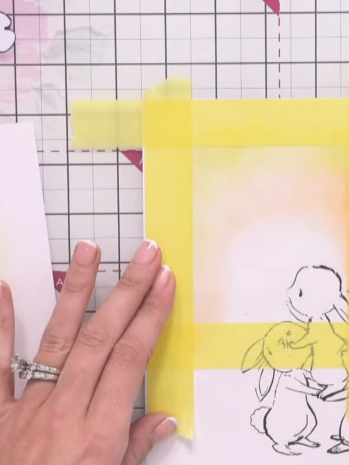 Step 11: Layer orange pigment ink over the yellow areas, blending gently to create a warm sunset effect around the stam
