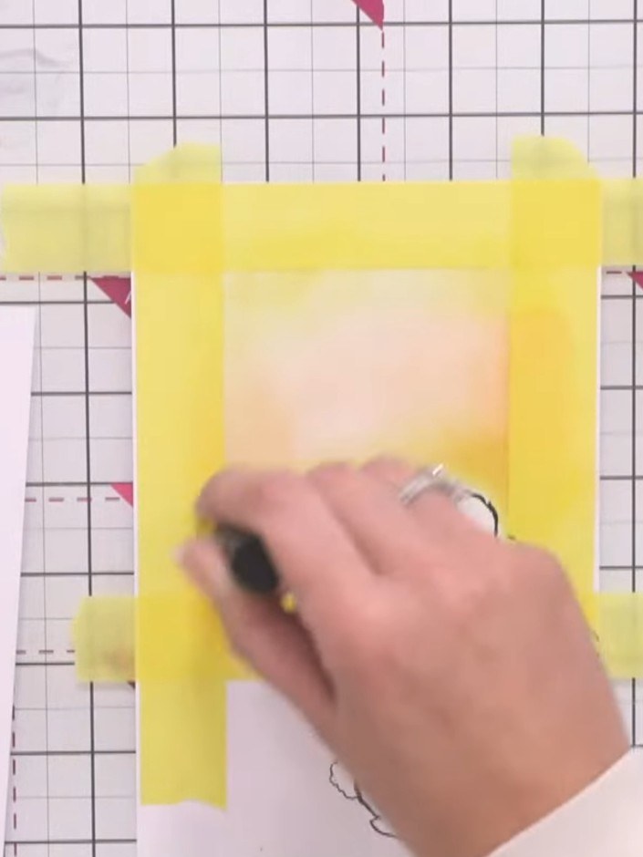 Step 12: Add touches of red pigment ink sparingly to the yellow inked area to create a tropical sky effect, blending ca