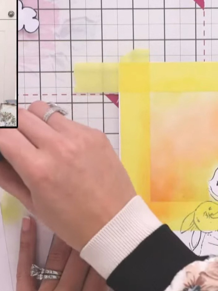Step 13: Carefully remove the masking tape from around the stamped image to reveal the coloured sky background with yel