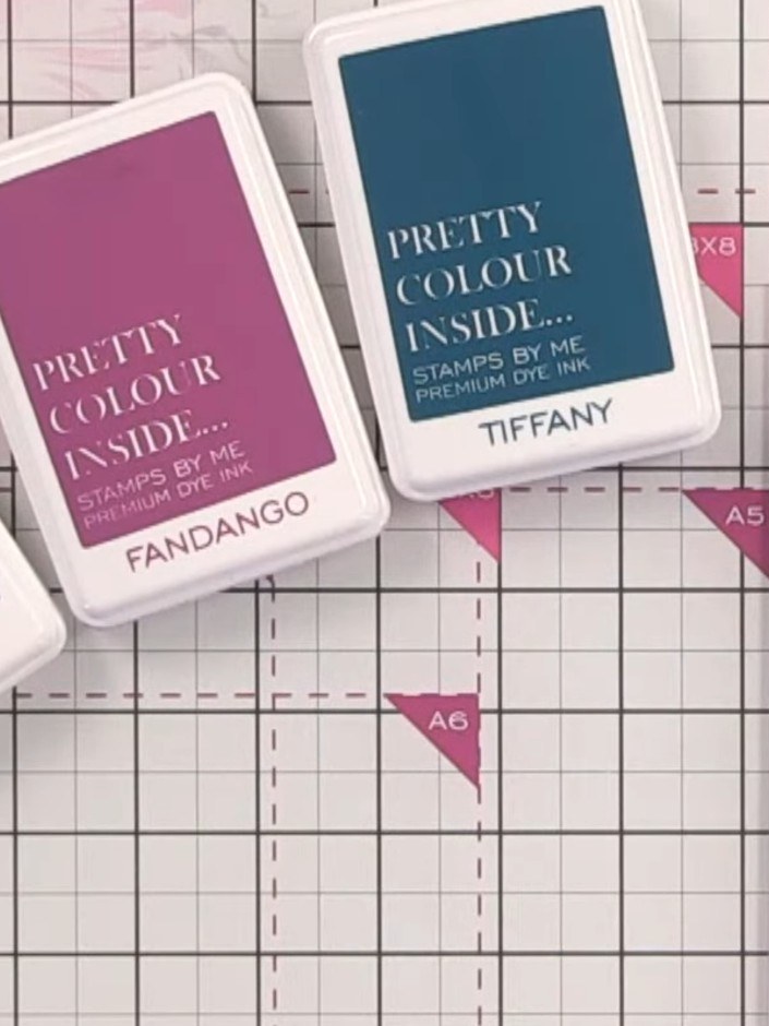Step 1: Gather three ink pads in coordinating colours. The demonstration uses Tiffany (teal blue), Fandango (pink), an