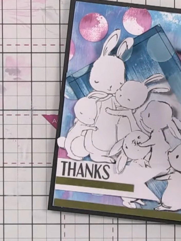 Step 14: Use a fine-line black pen to draw a frame around the edge of the card front, creating a border that enhances t