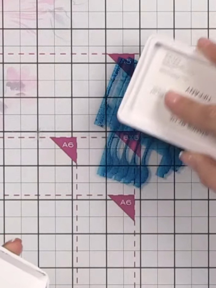Step 2: Apply Ocean ink to your card base using a water brush, creating a soft watercolour wash across the surface. Le