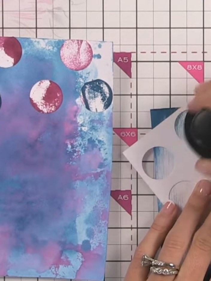 Step 9: Using a white ink pad, swipe across portions of your watercolour background to soften darker areas. Use the pu