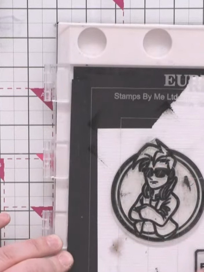 Step 14: Stamp the character image (Crash) onto white card using black ink. Fussy cut around the character to remove th