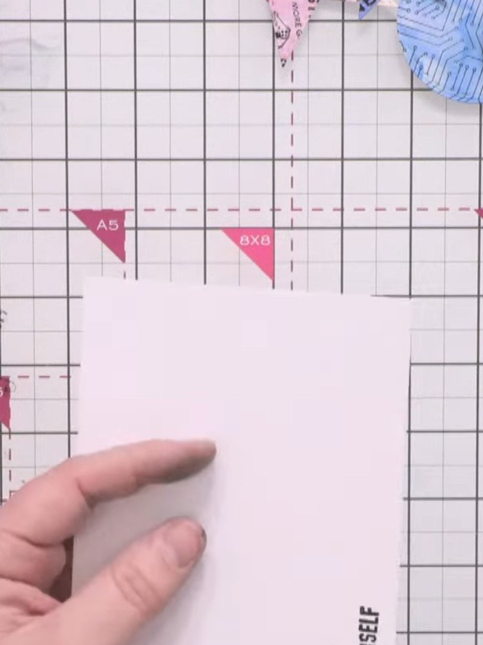 Step 6: Cut a piece of white card to 4½ by 7 inches to create a border frame for the card.