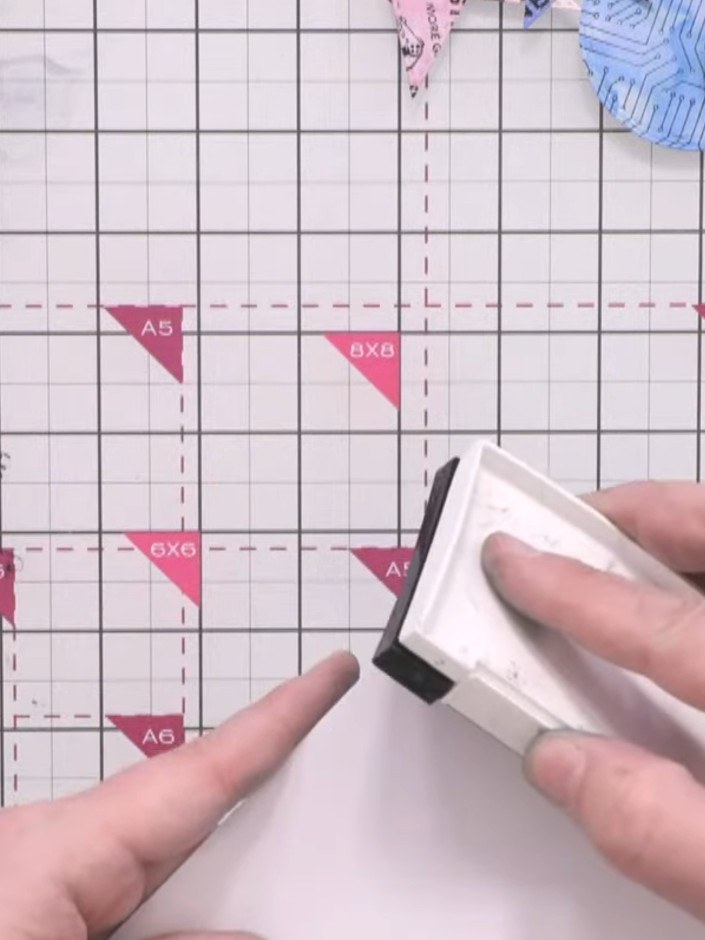 Step 8: Ink the edges of the white card frame with the black ink pad, brushing around the perimeter to create a define