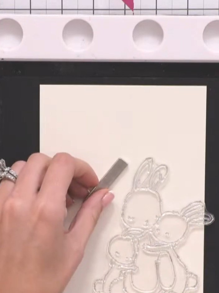 Step 2: Stamp the bunny image in the corner of your card using black ink. Position the stamp carefully and press firml