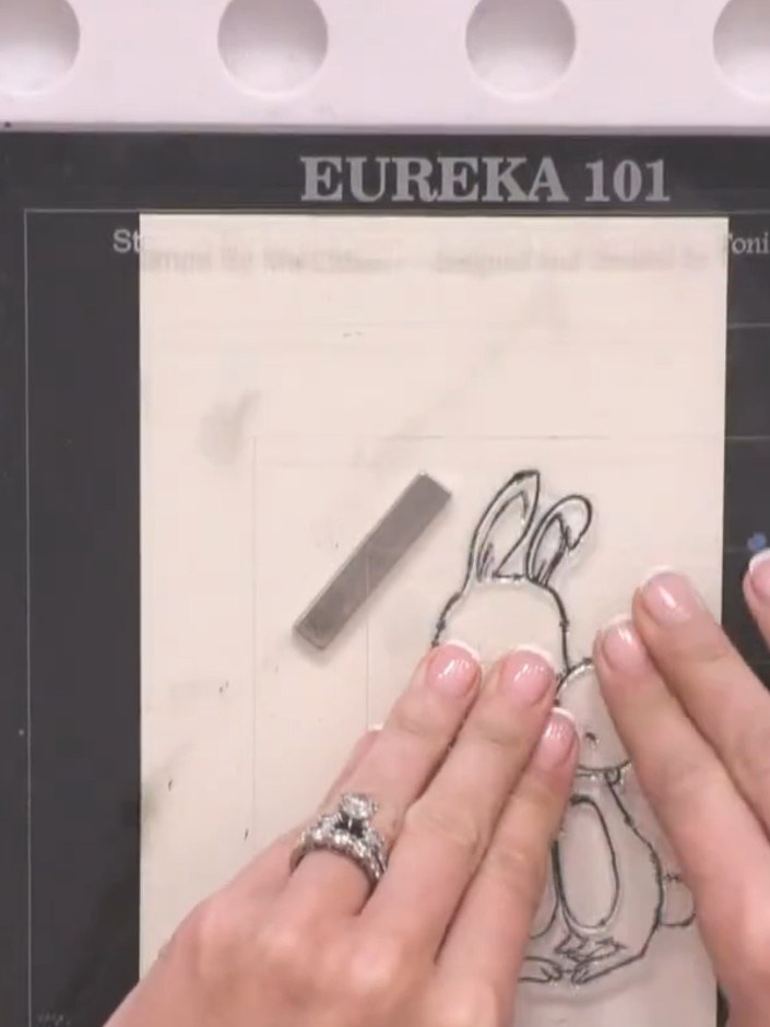 Step 3: Dry the stamped bunny image completely using a heat tool. Hold the heat tool over the stamped design until the