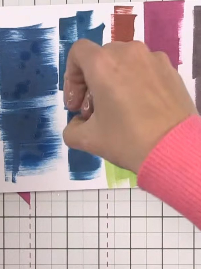 Step 4: Apply water to the inked card using a water-soaked hand or spray bottle to activate the reactive ink. Create a