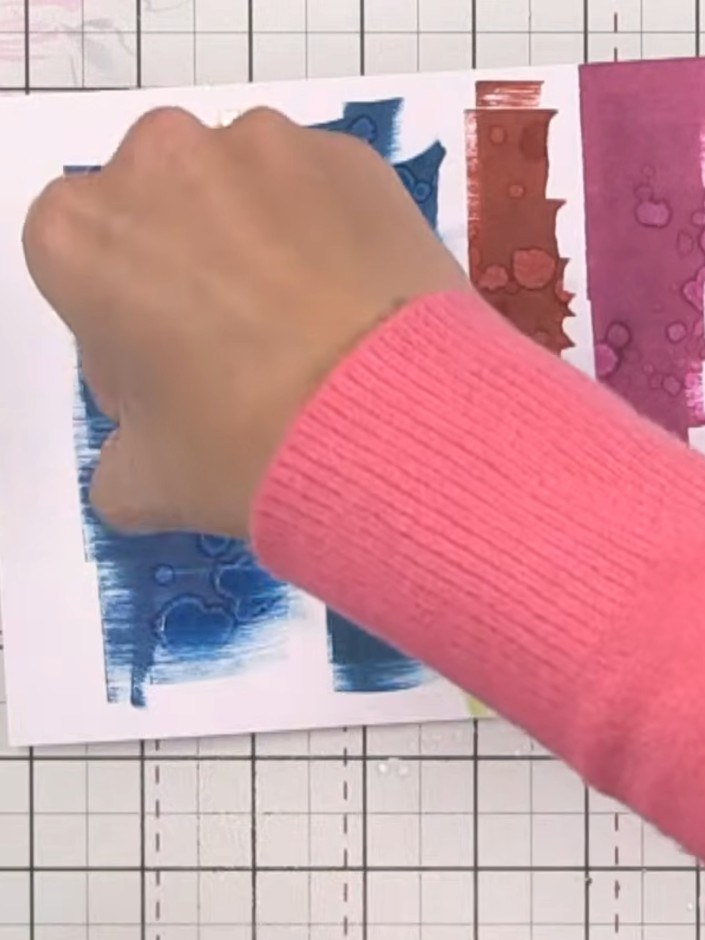 Step 5: Wet the stamped areas with plenty of water using a wet wipe or damp cloth. Watch as the colours pull out to li