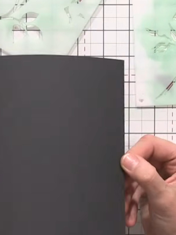 Step 1: Place your black card stock on the craft mat. Ensure your rose branch stencil is completely clean and free fro