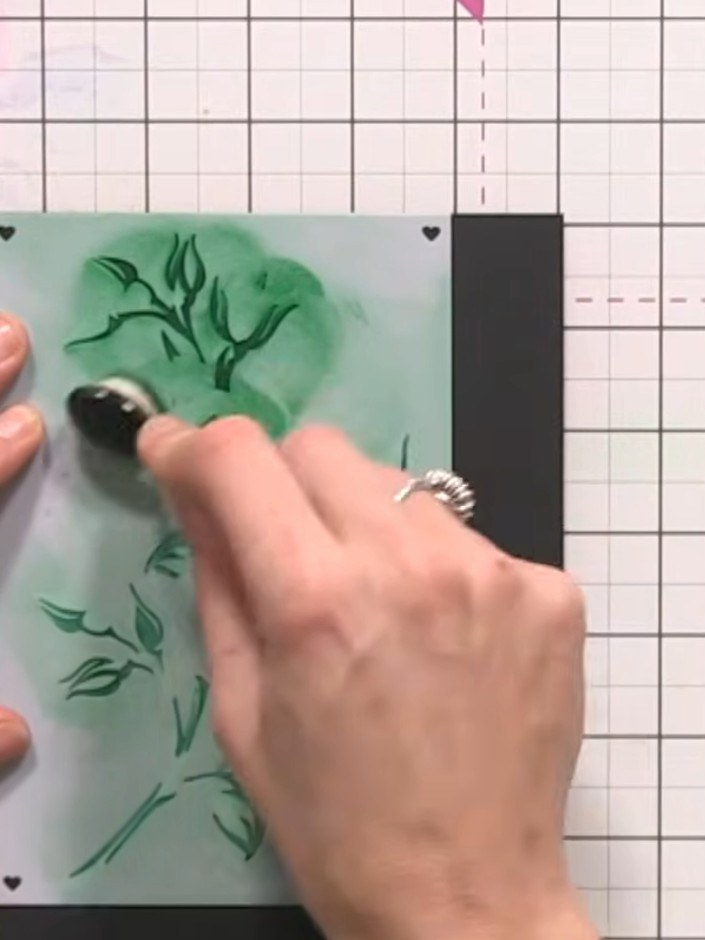 Step 12: Position stencil number five over your card and apply green ink through the stencil using a blending tool, pre