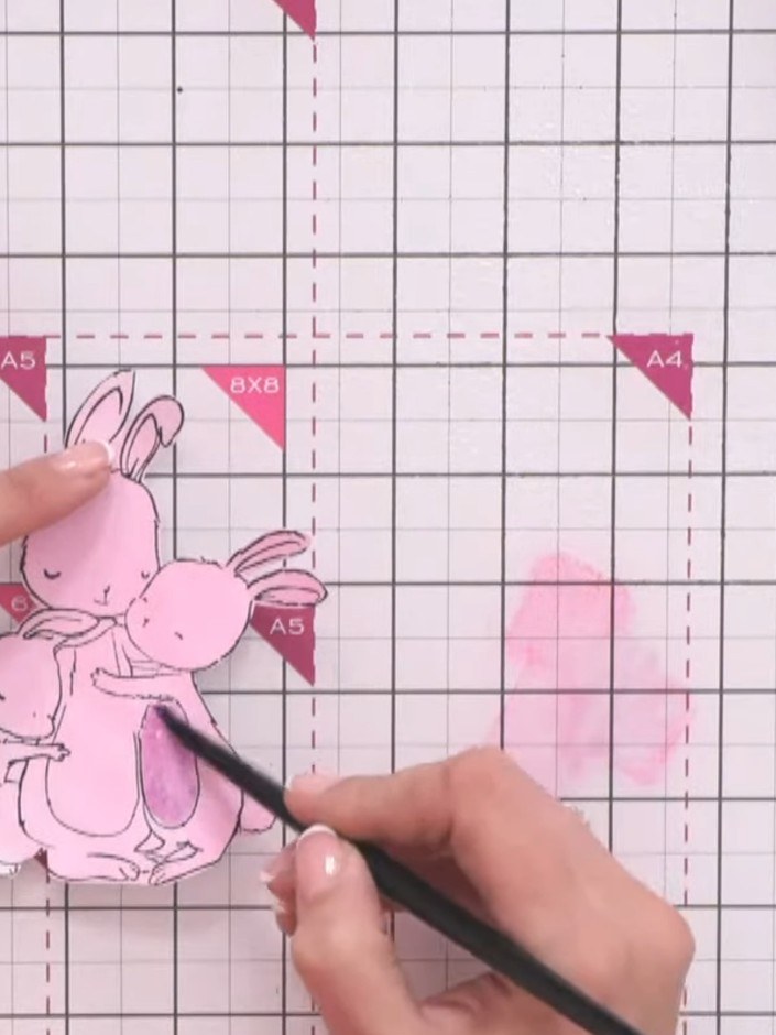 Step 12: Add shading and detail to the bunny tummies using a brush with pink ink mixed with water. Build up the colour 
