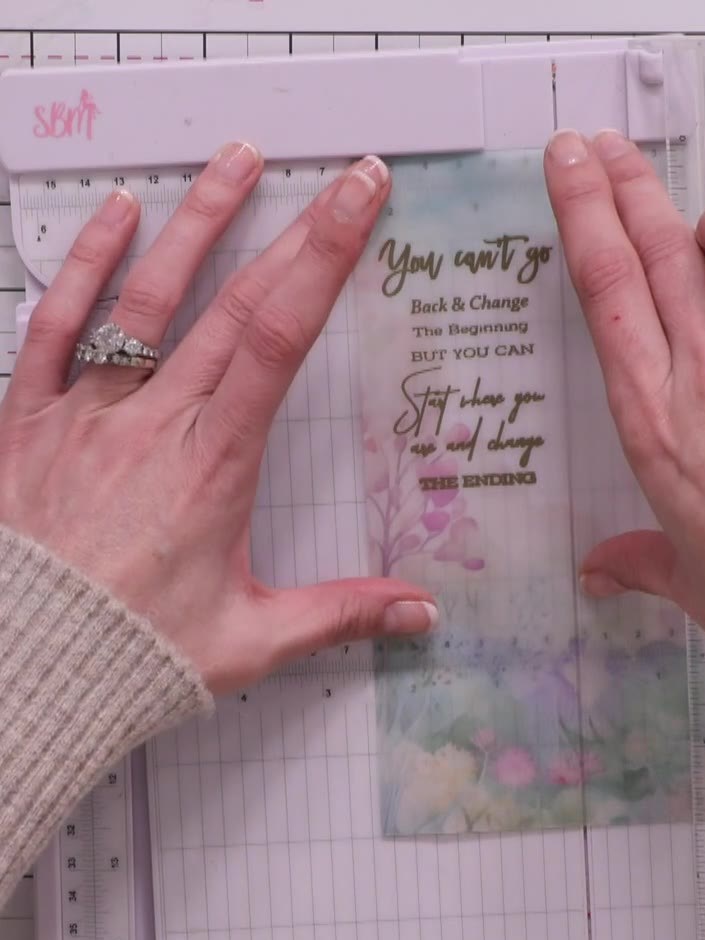 Step 9: Cut the embossed vellum strip to size using a ruler and trimmer. Adhere the vellum strip down the side of your