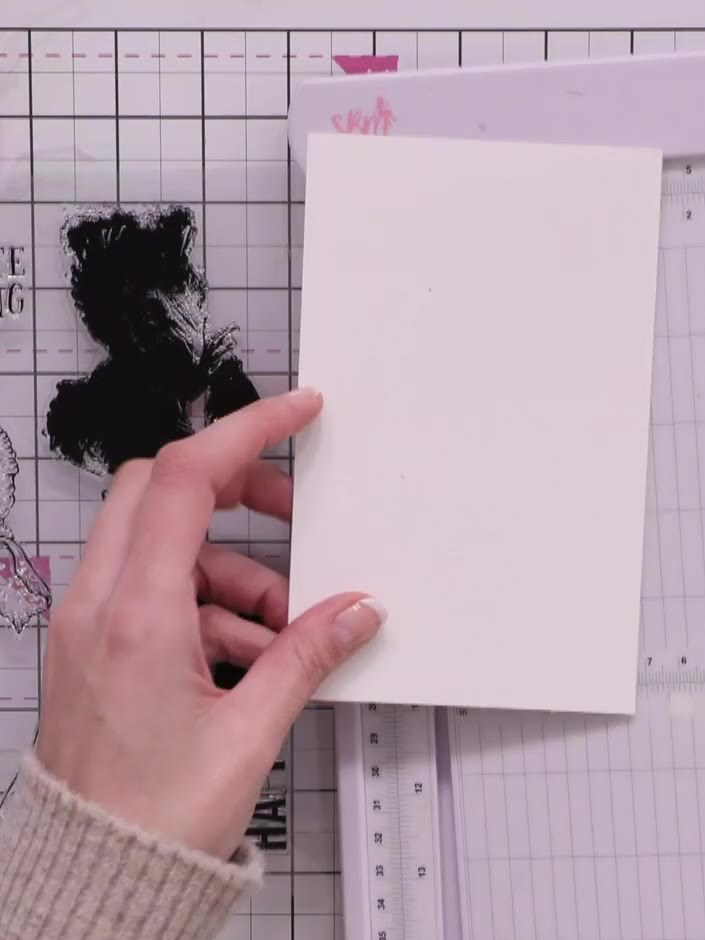 Step 2: Select the solid portion of your lamination stamp and ink it with a light grey distress ink pad, covering the 