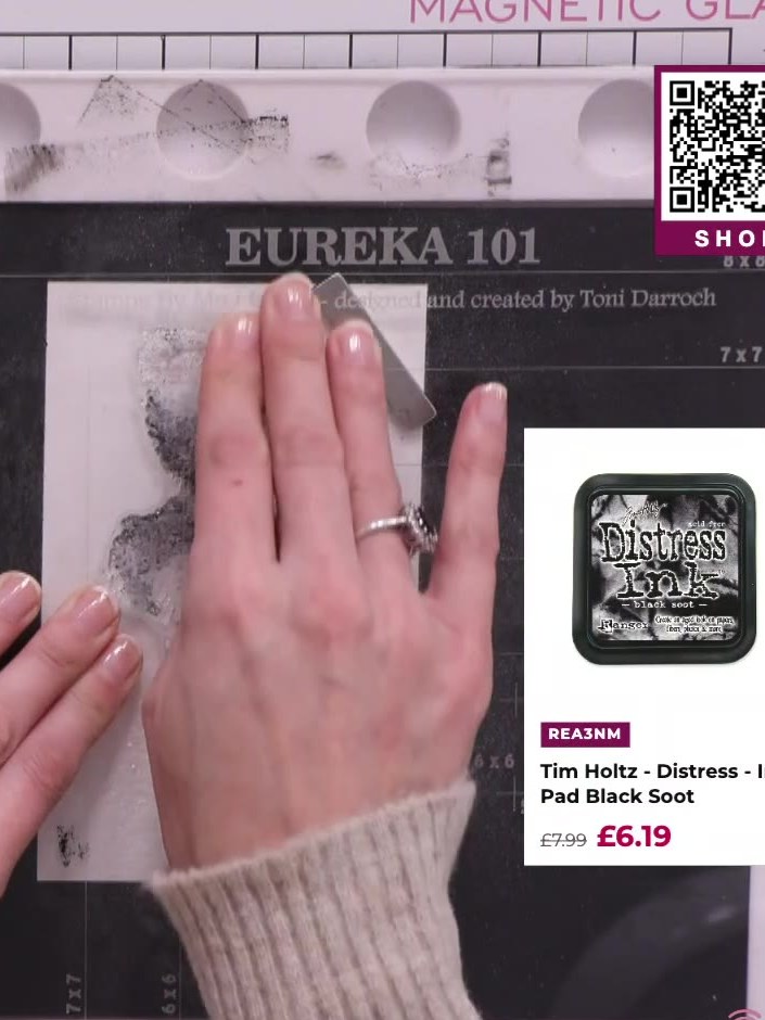 Step 4: Spray the inked stamp with water to blend the grey and black inks together. Use your fingers to gently work th
