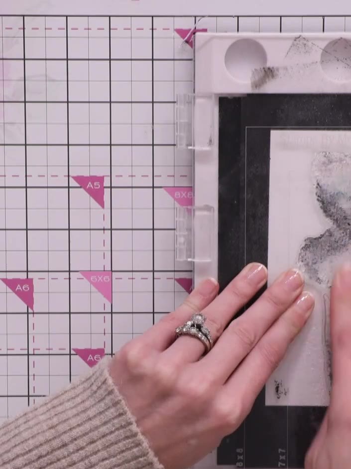 Step 5: Press the stamp firmly onto the watercolour cardstock, allowing the black ink to blend and create natural vari