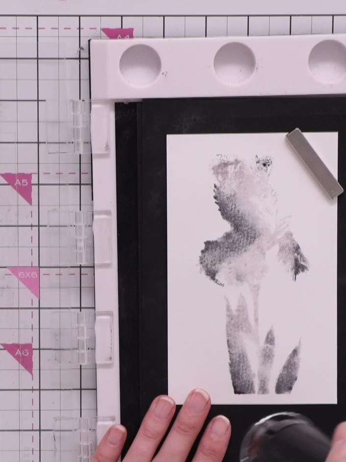 Step 8: Heat-dry the stamped cardstock using a heat gun with quick on-and-off motions to avoid warping the paper.