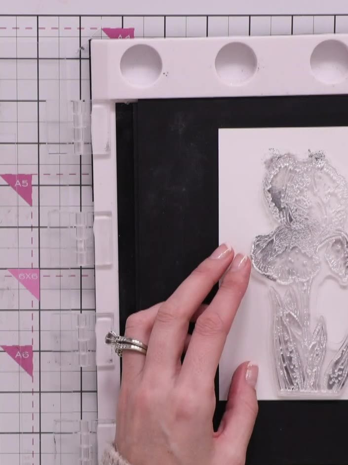 Step 9: Select the detail portion of the stamp and ink it with solid black ink. Position the stamp carefully on the st