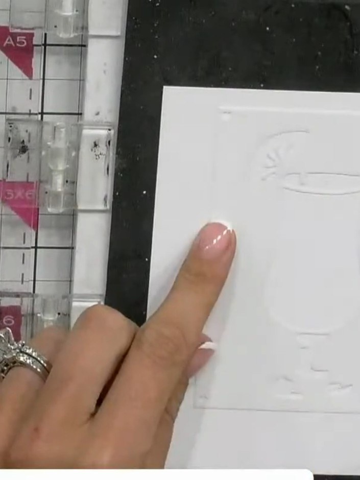 Step 1: Position stencil number one in the corner of your white cardstock. Secure it in place with a magnet to prevent