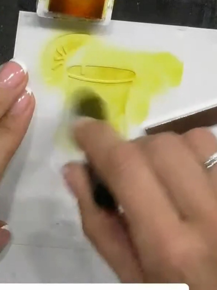 Step 2: Apply yellow ink through the stencil using a brush, working the colour through the design. Build up the colour