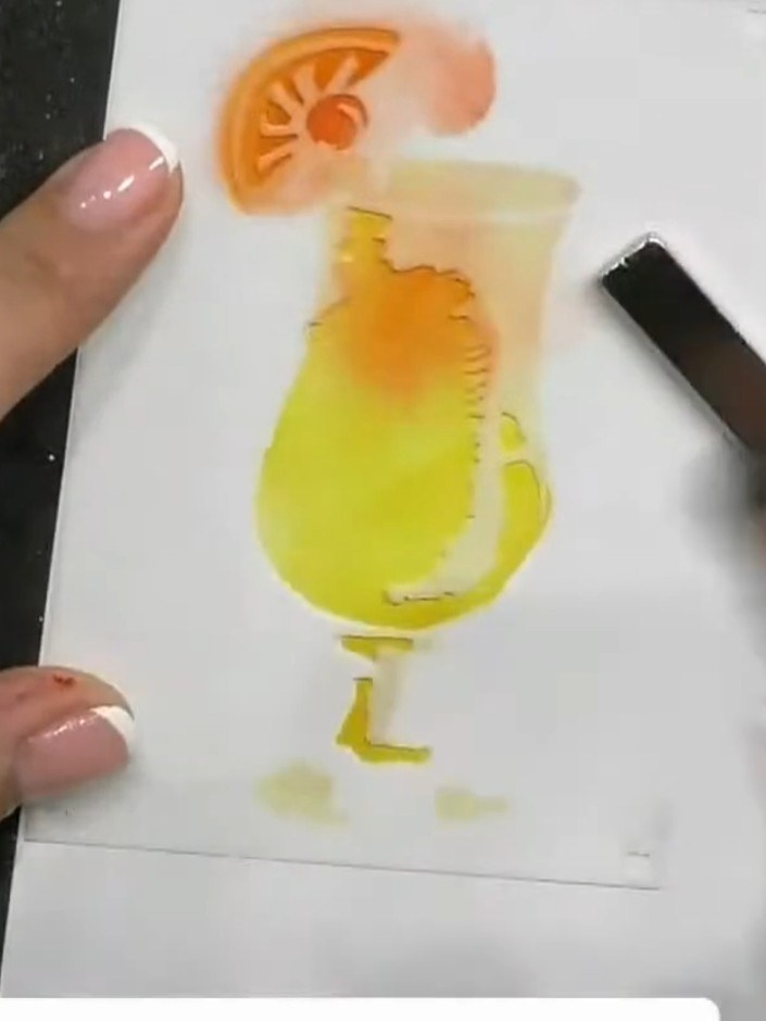 Step 4: Apply orange ink through stencil two using a blending brush, building up the colour intensity by pressing hard