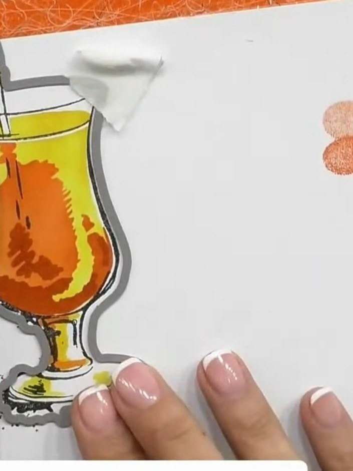 Step 7: Stamp the cocktail glass design from the Quattro D Tequila Sunrise stamp set in black ink onto the stencilled 