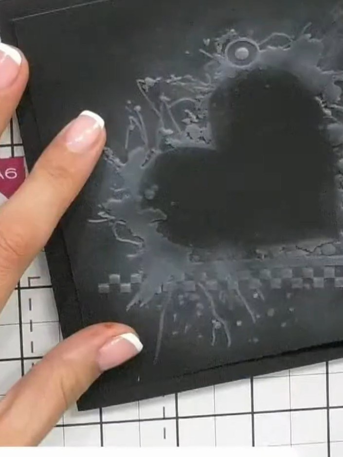 Step 11: Adhere the finished embossed piece to a card base using foam pads to add dimension and showcase the 3D embossi