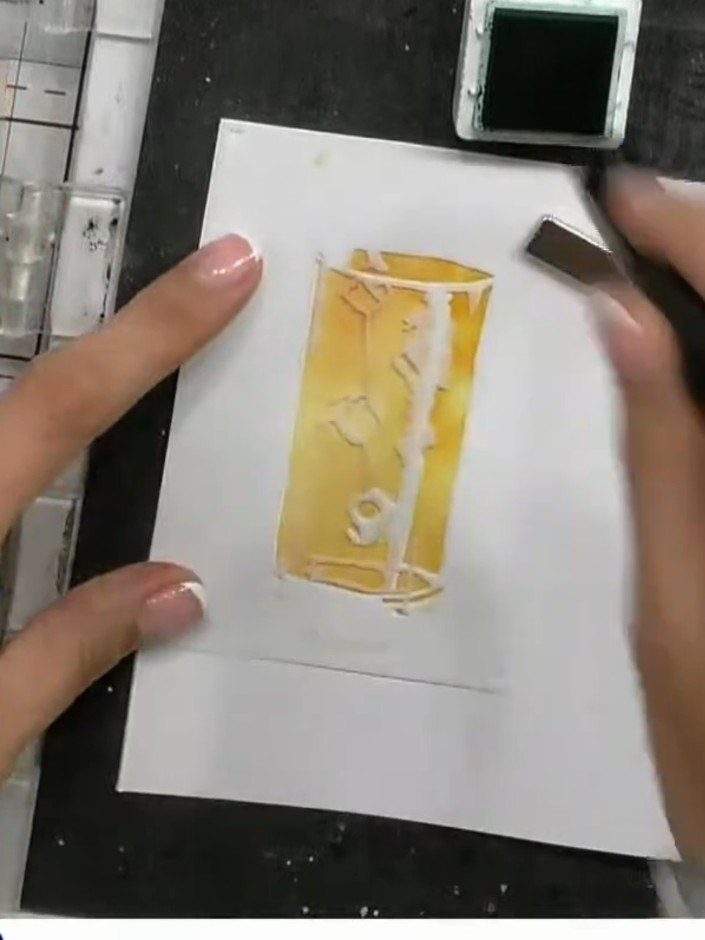 Step 2: Apply green ink through the stencil using a blending brush, working over the design area to create the base co