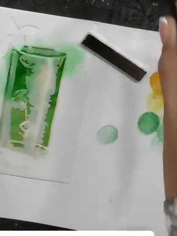 Step 3: Remove the first stencil and position the second stencil in the same corner of the card. Ensure it is aligned 